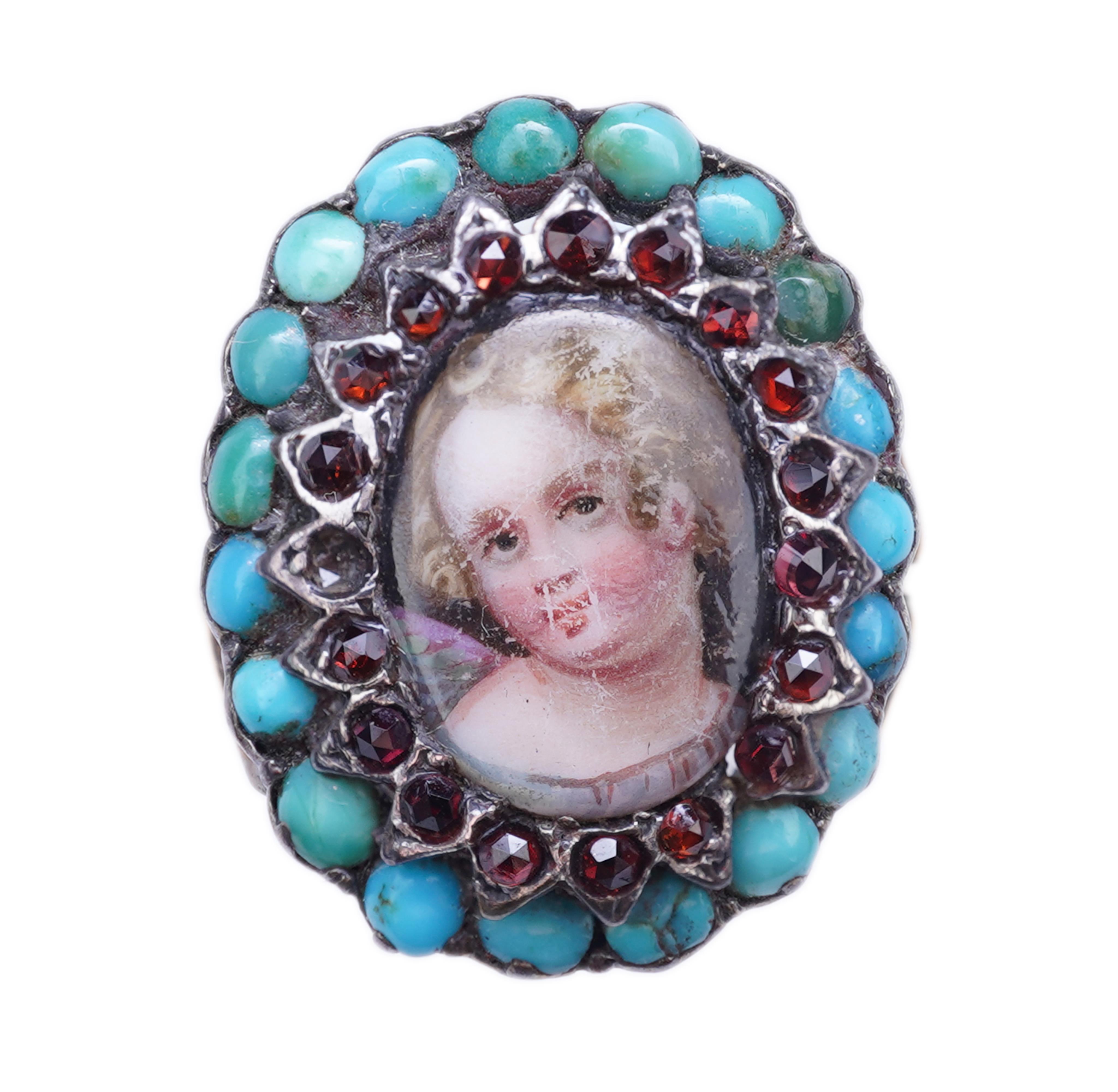 An enamel miniature, turquoise and garnet ring